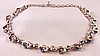 SJ105 Trifari rhodium bow necklace w blue rhinestones
